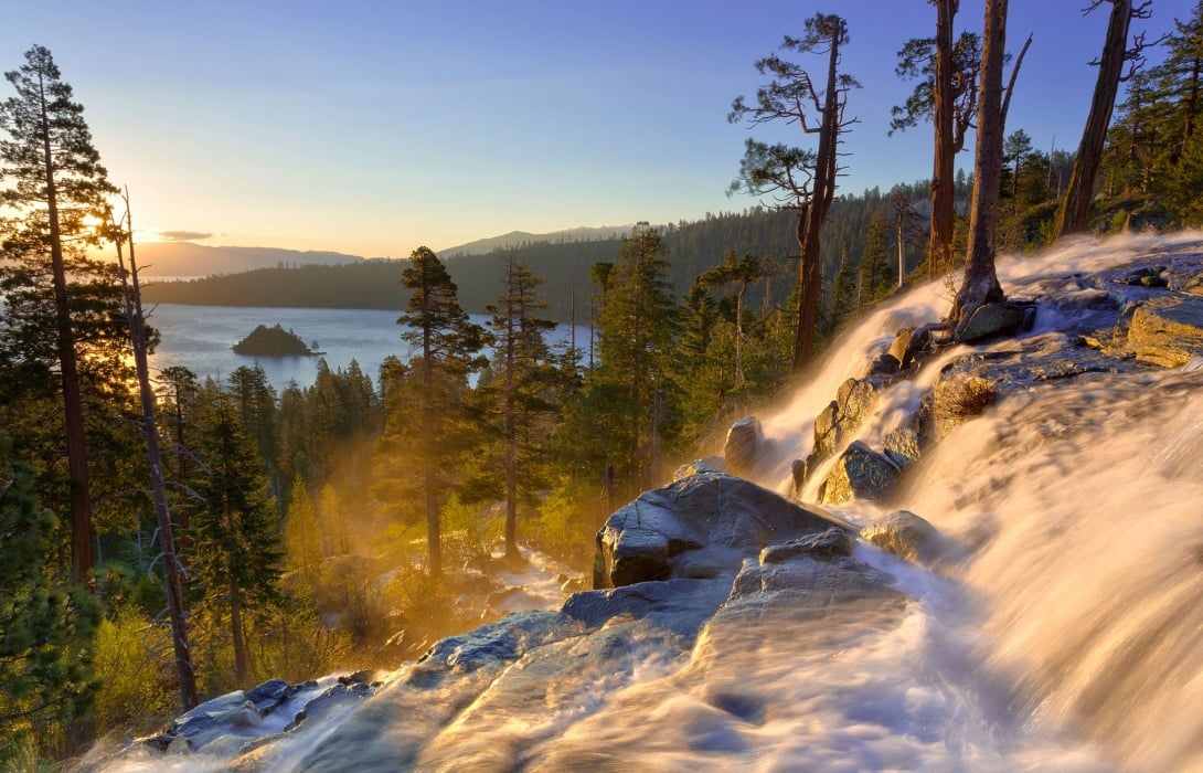 Ice formation rocks on the mountain with tall trees overlooking the lake