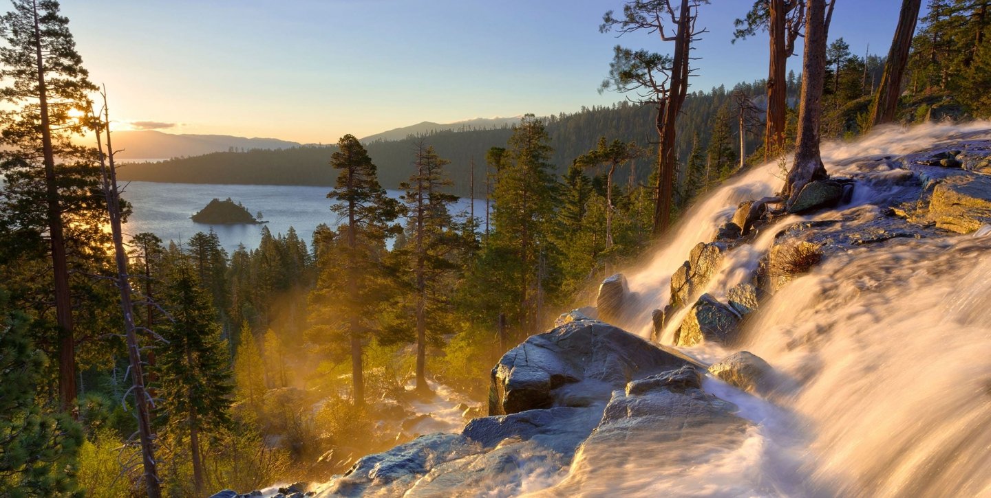 Ice formation rocks on the mountain with tall trees overlooking the lake