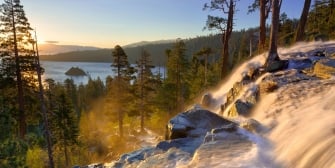 Ice formation rocks on the mountain with tall trees overlooking the lake