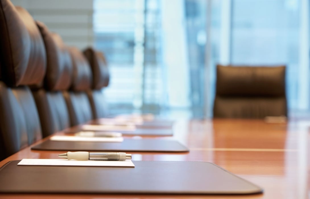A close up of the board room table setup