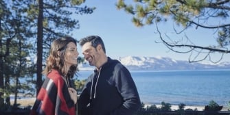 A couple laughing together in the outdoors