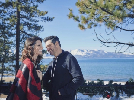 A couple laughing together in the outdoors