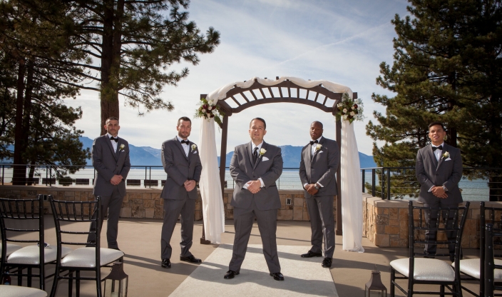 Groom and the groomsmen standing on the aisle