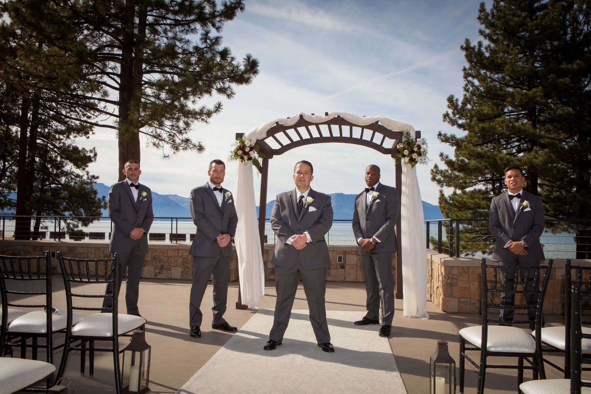 Groom and the groomsmen standing on the aisle