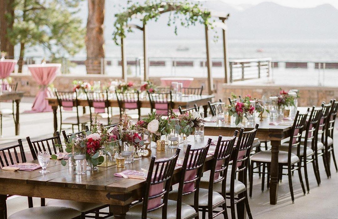 Wedding dinner venue with flowers on the water