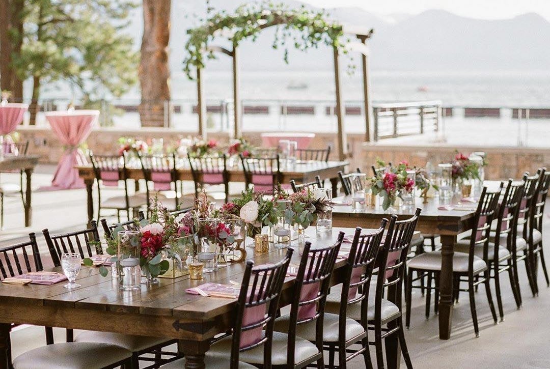 Wedding dinner venue with flowers on the water