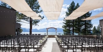 Wedding ceremony venue with empty chairs on the water