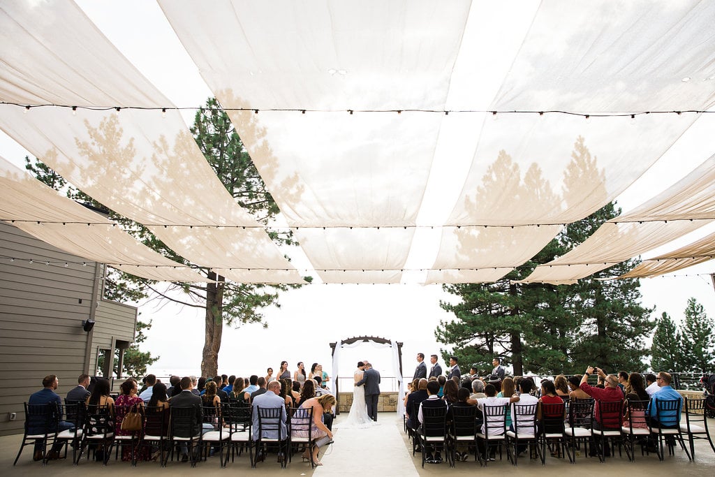 A wedding ceremony taking place with the bride groom, and guests