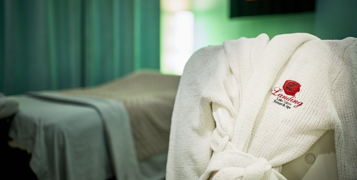The Landing Resort and Spa robe placed on a chair next to the spa bed