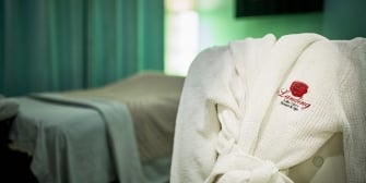 The Landing Resort and Spa robe placed on a chair next to the spa bed