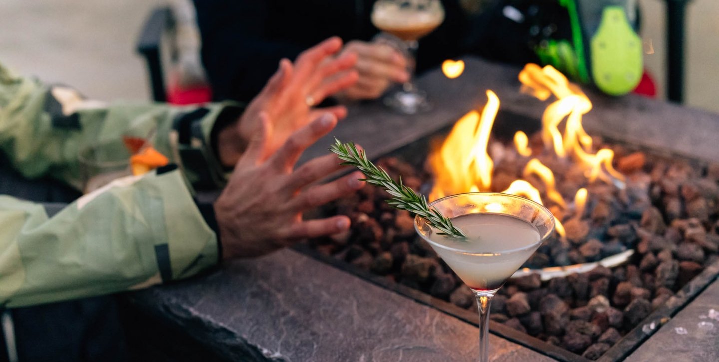 The Landing Tahoe Fire pit with a martini