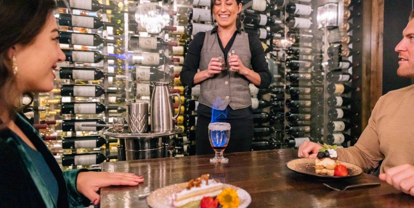 Waitress giving a couple their dessert at a restaurant