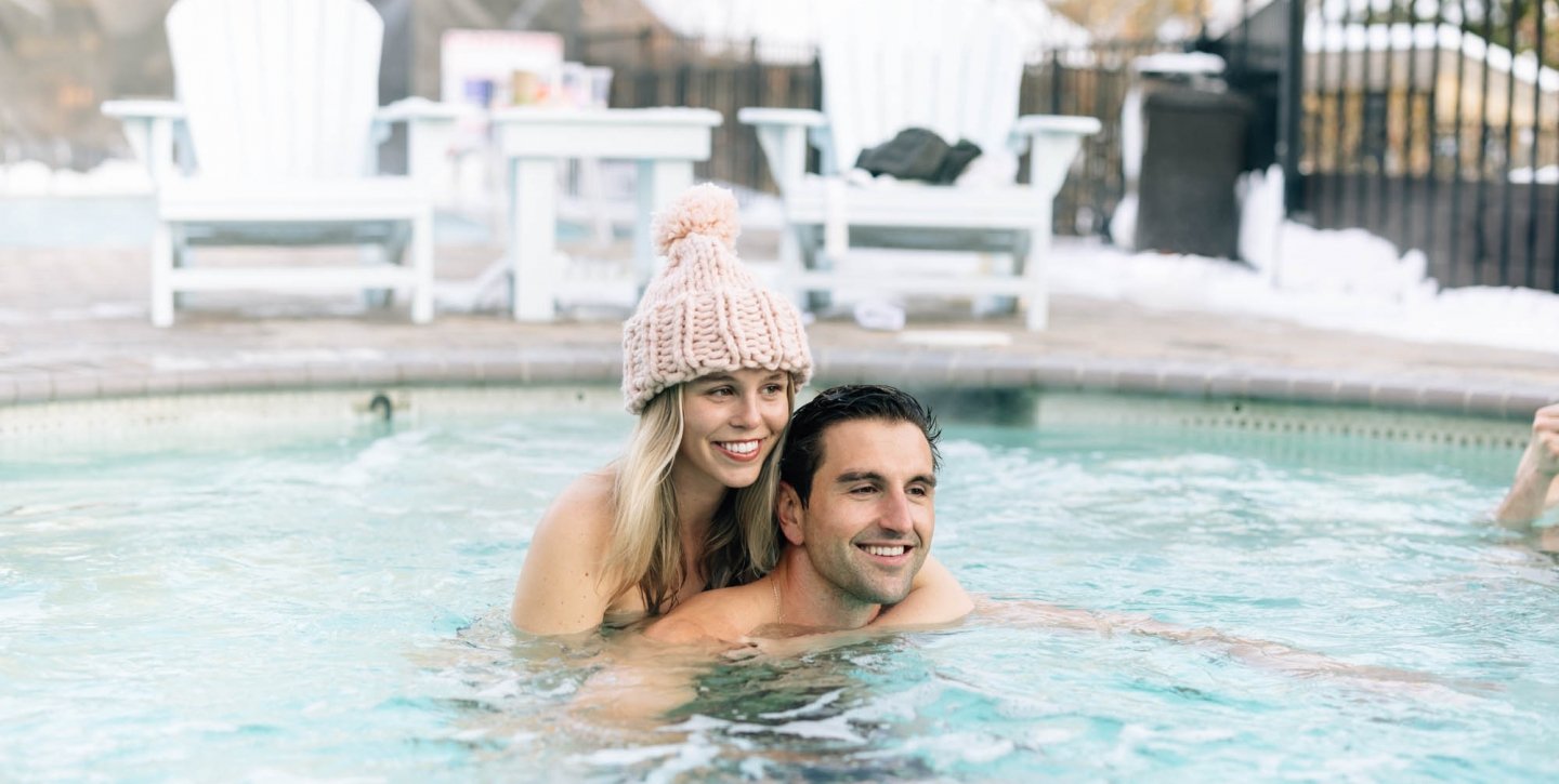 a couple hugging in the pool