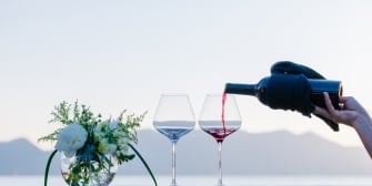 Wine pour with a Lake and Mountain backdrop