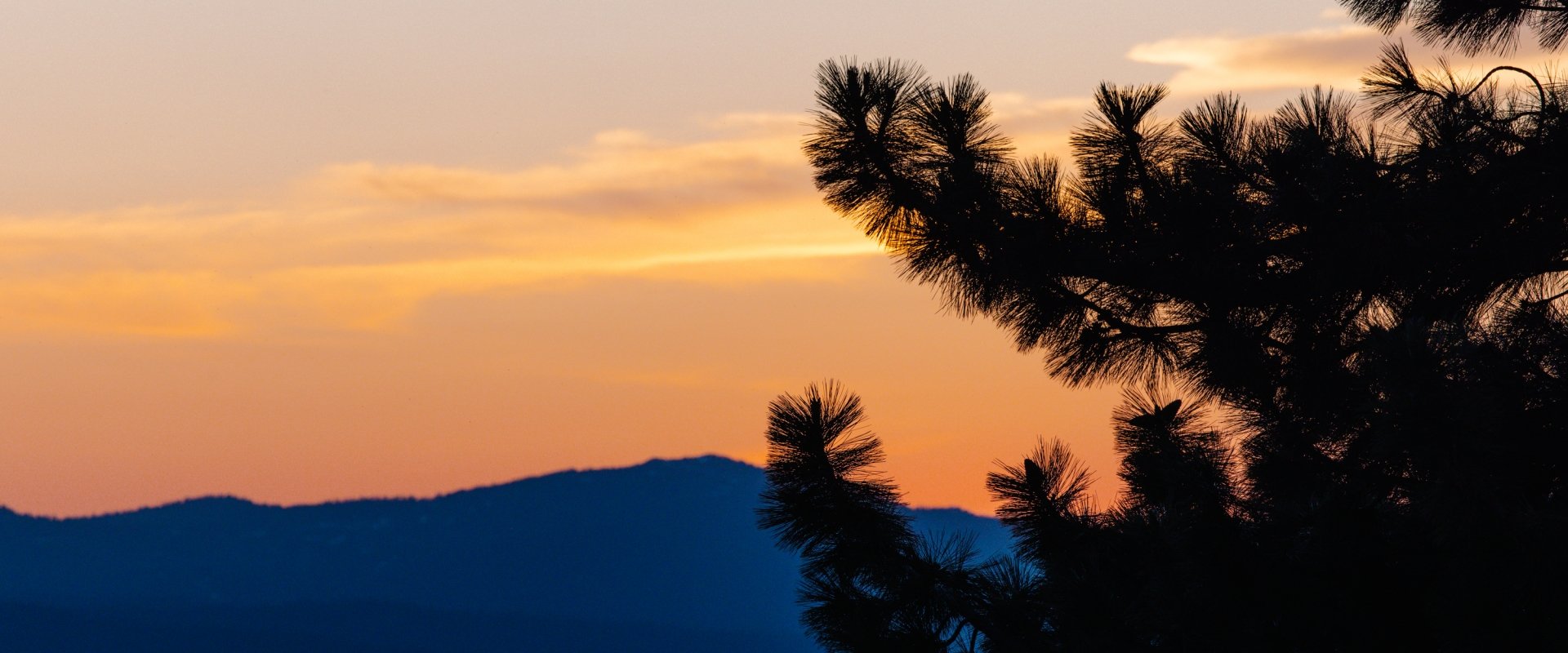Lake and mountains in the background at sunset