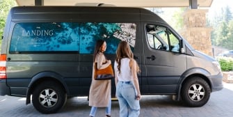 Guests using house shuttle car