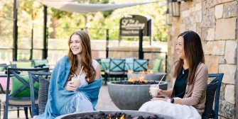 Guests enjoying coffee in front of Jimmy's fireplace
