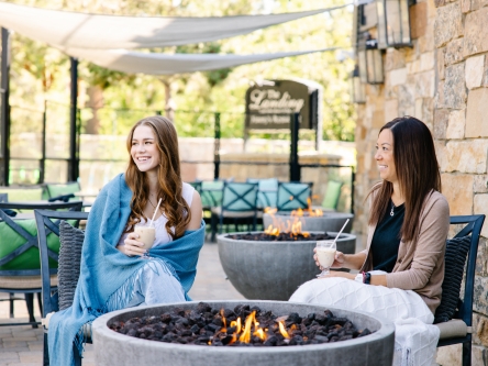 Guests enjoying coffee in front of Jimmy's fireplace