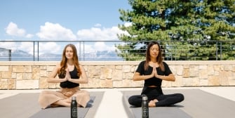 Rooftop Terrace Yoga with mountains in the background