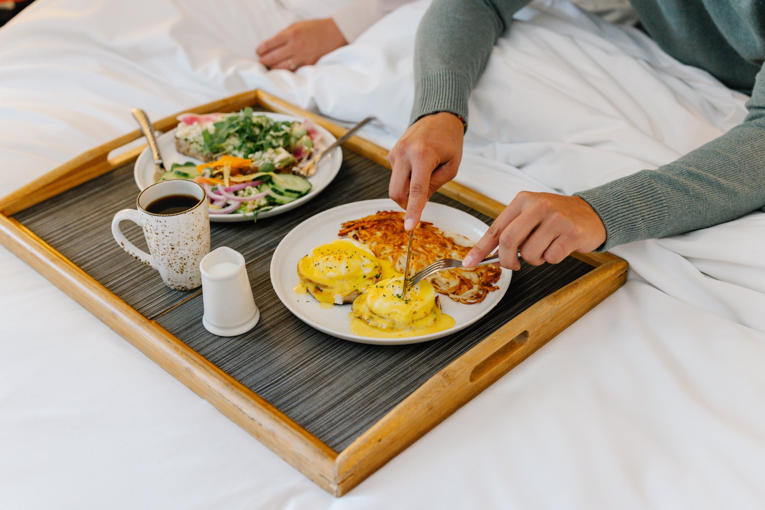 Couple eating breakfast in bed