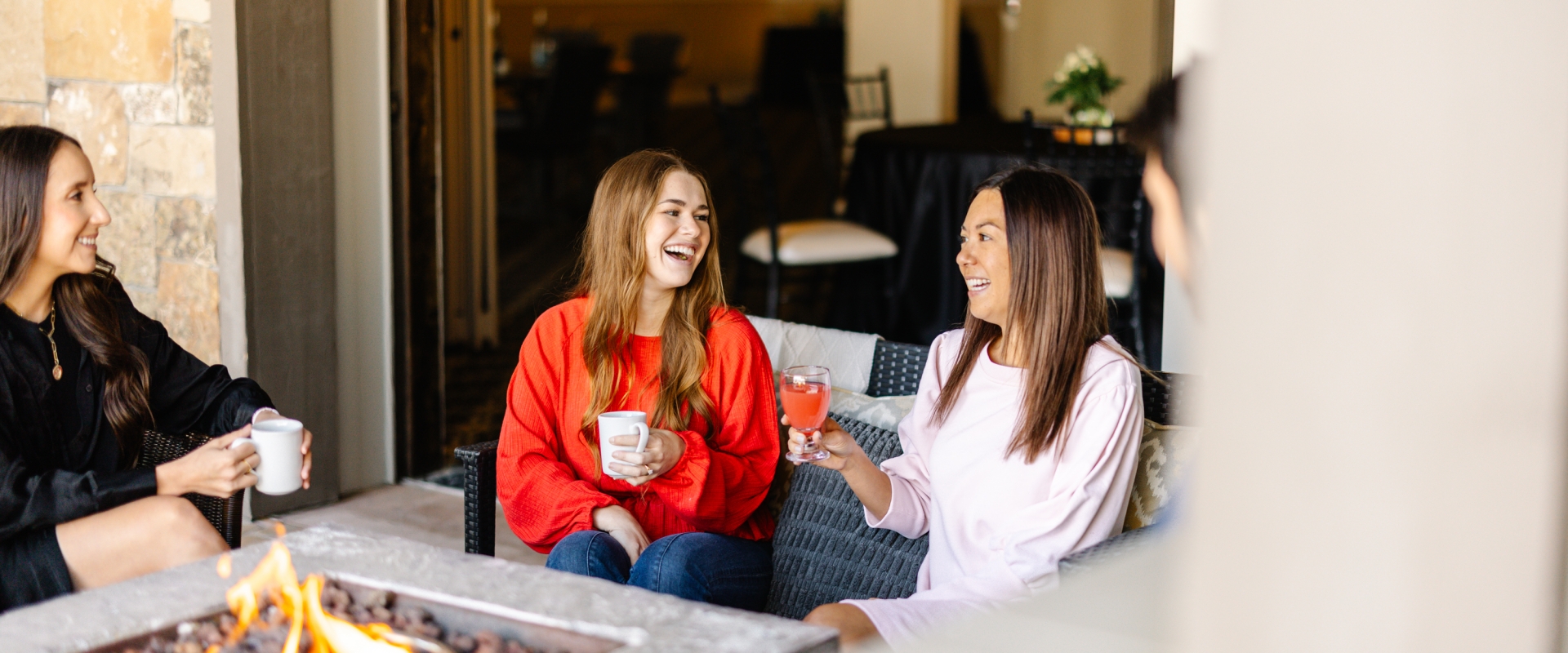 Group talking outside enjoying drinks