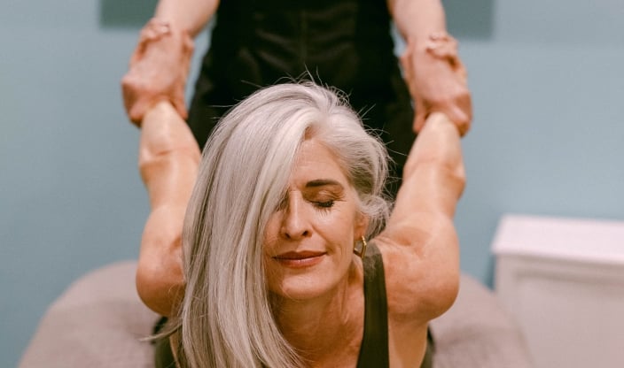 Woman receiving Table Thai massage