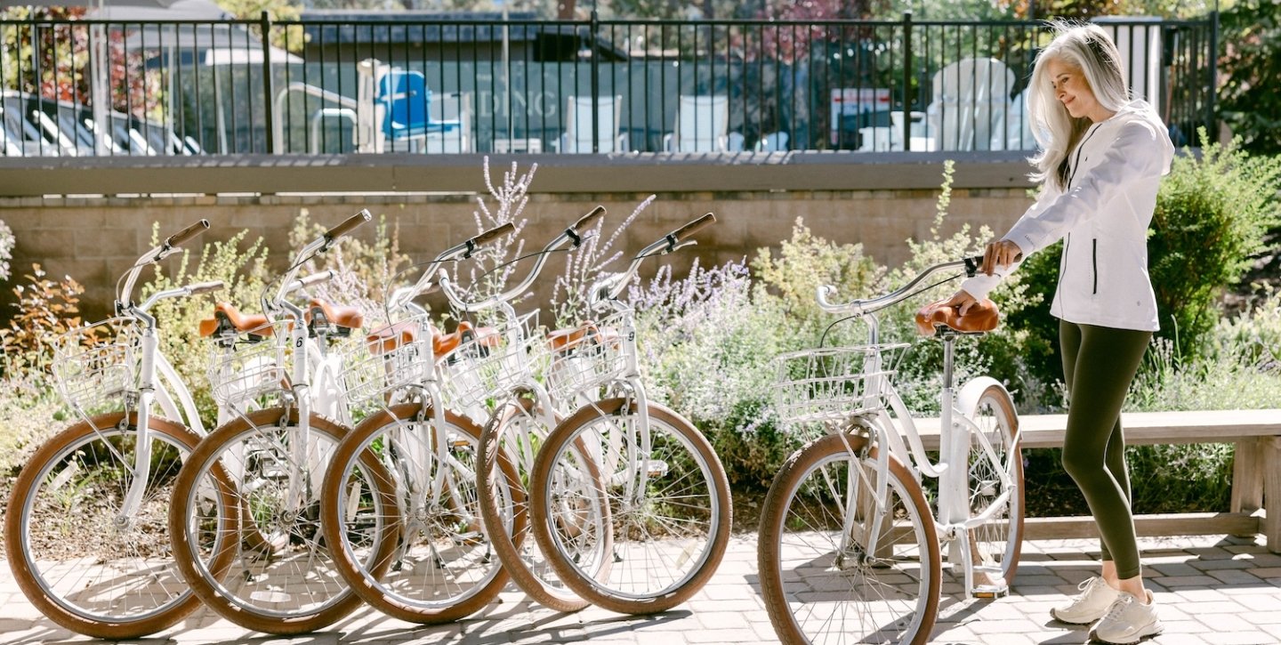 Woman taking one of the white bikes