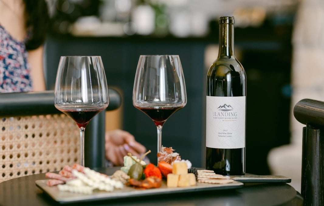 Two glasses of wine with a charcuterie board