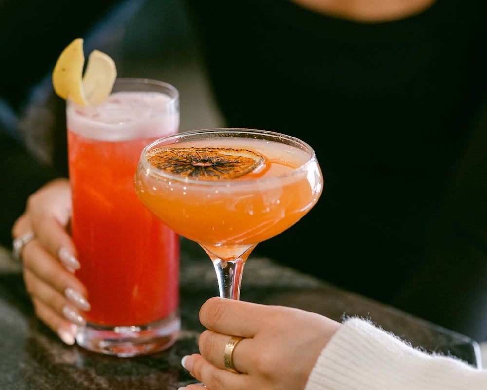 Two people enjoying Jimmy's Cocktails