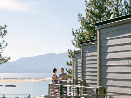 Two people drinking wine on Landing Balcony
