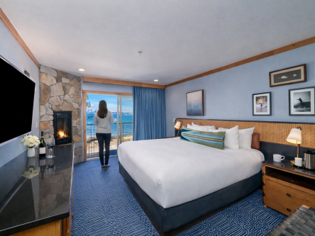 Landing King with Woman on Balcony looking at Lakeside View