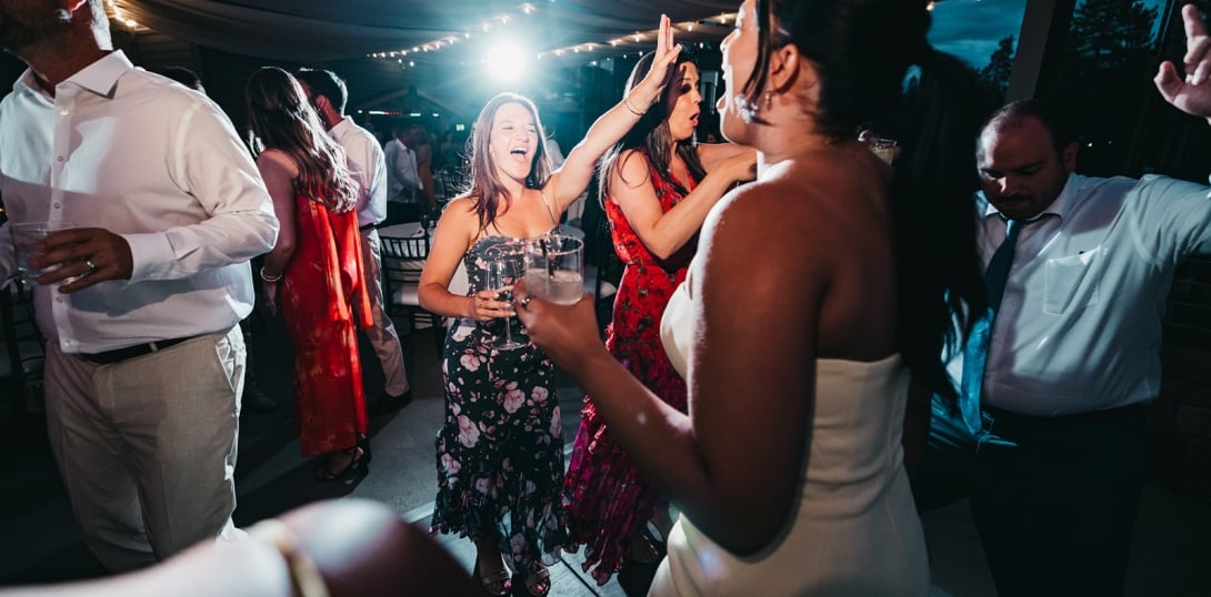 A group of people dancing and having fun at an event.